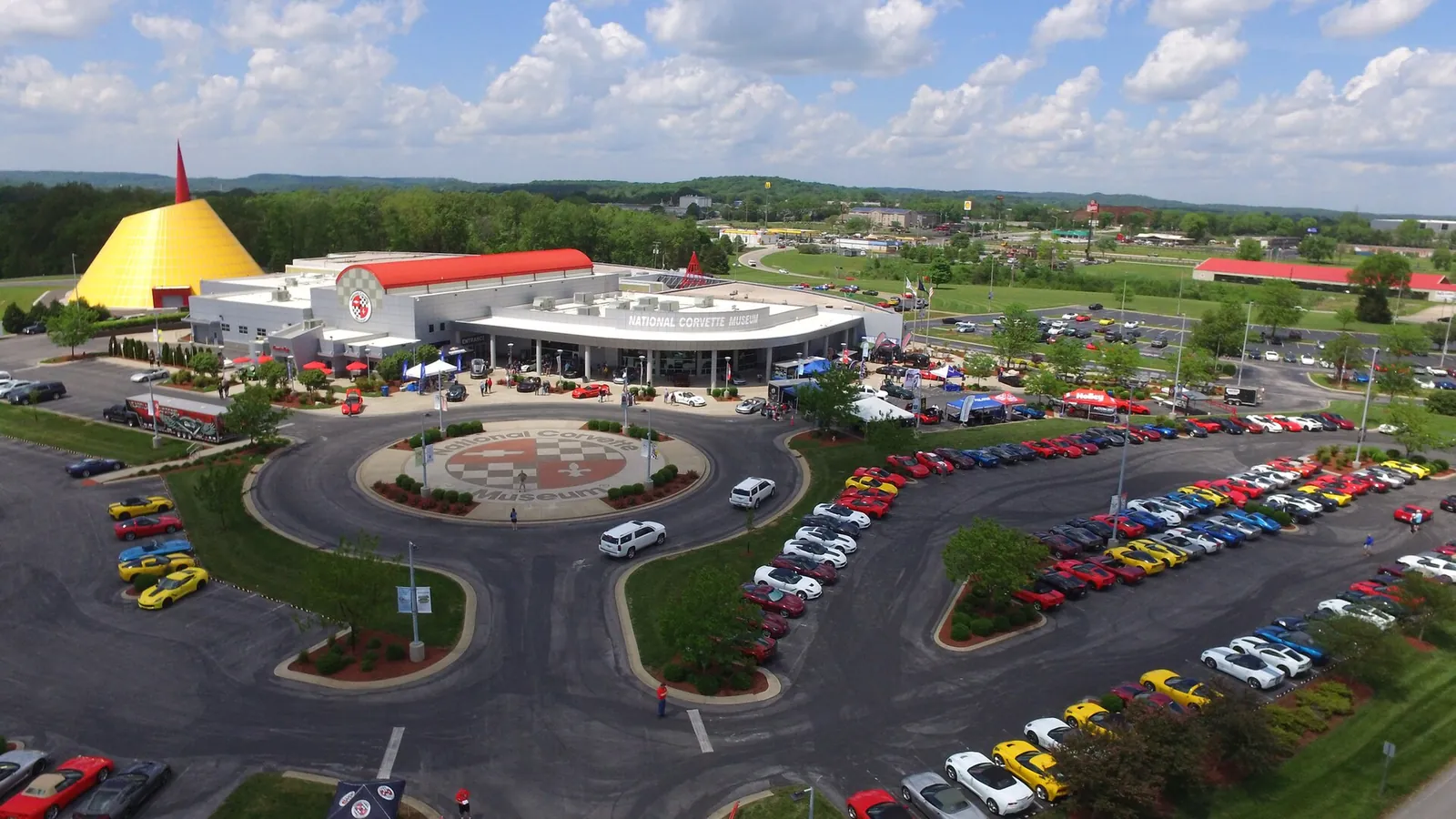 An aerial view of the National Corvette Museum in Bowling Green, its parking lots filled with Corvettes
