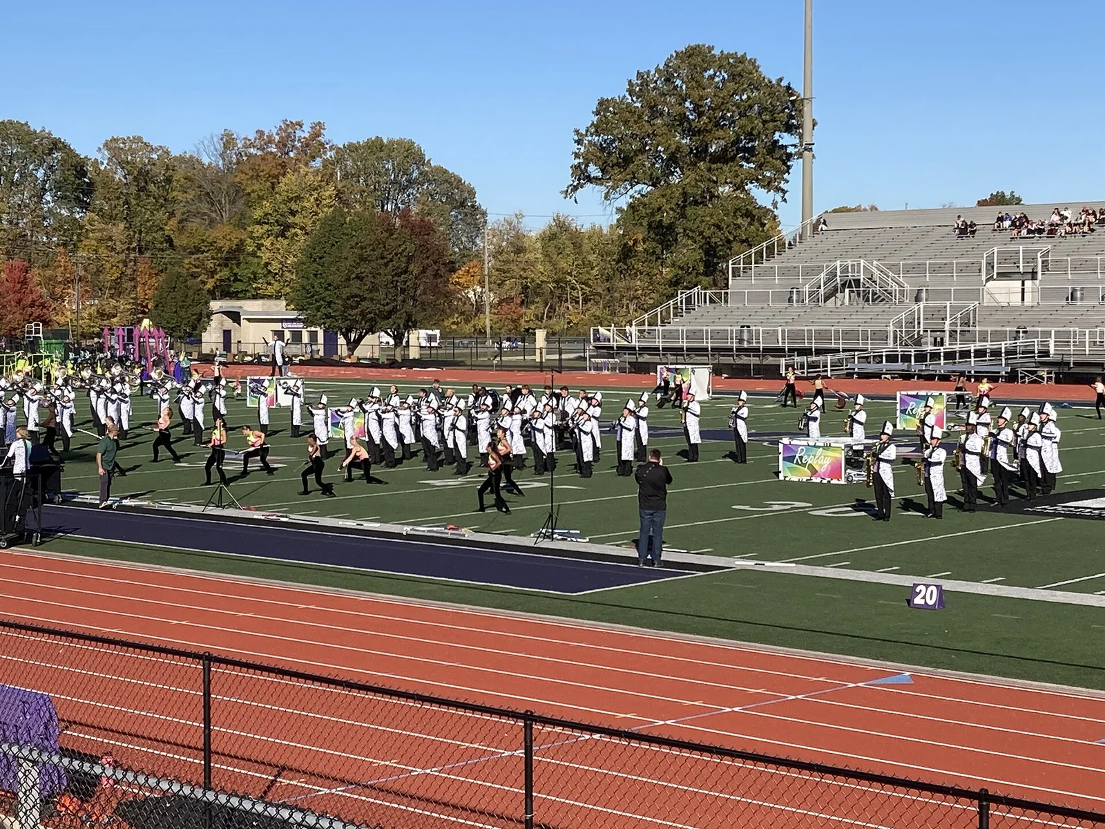 A high school marching band performs a field show at a competition. The picture does not show the Kentucky championship.