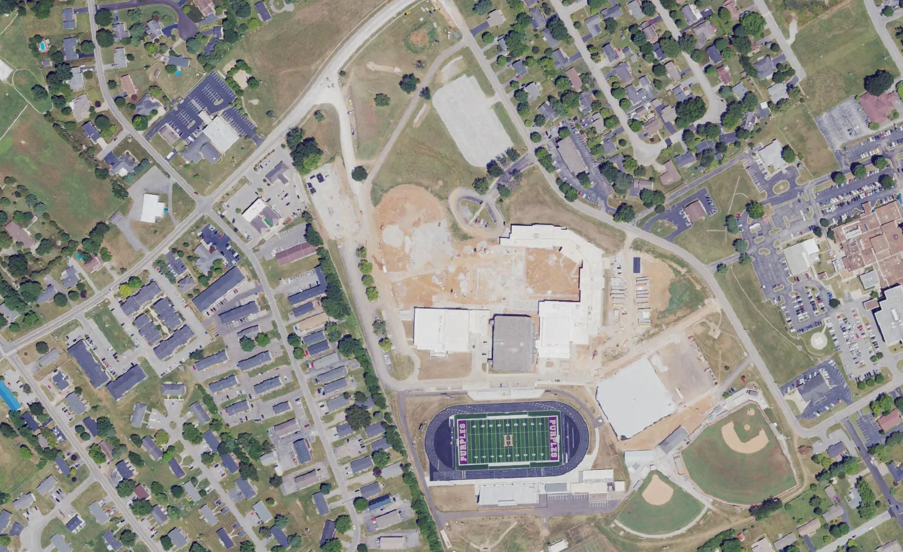 Bowling Green High School on Rockingham Lane, with construction under way beside the football field, seen from the air in 2022
