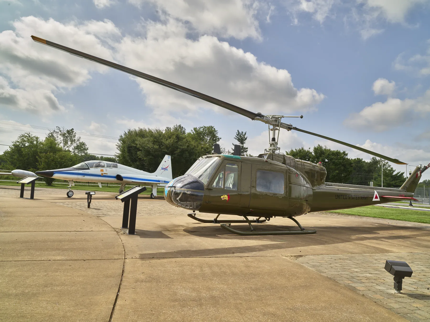 A Bell UH-1 Huey helicopter and a T-38 jet on display at Aviation Heritage Park, Bowling Green, Ky. The picture does not show the parade.