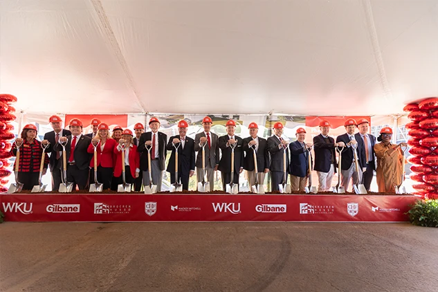 University and project leaders with ceremonial shovels at The Southern Gateway groundbreaking on Western Kentucky University's campus.